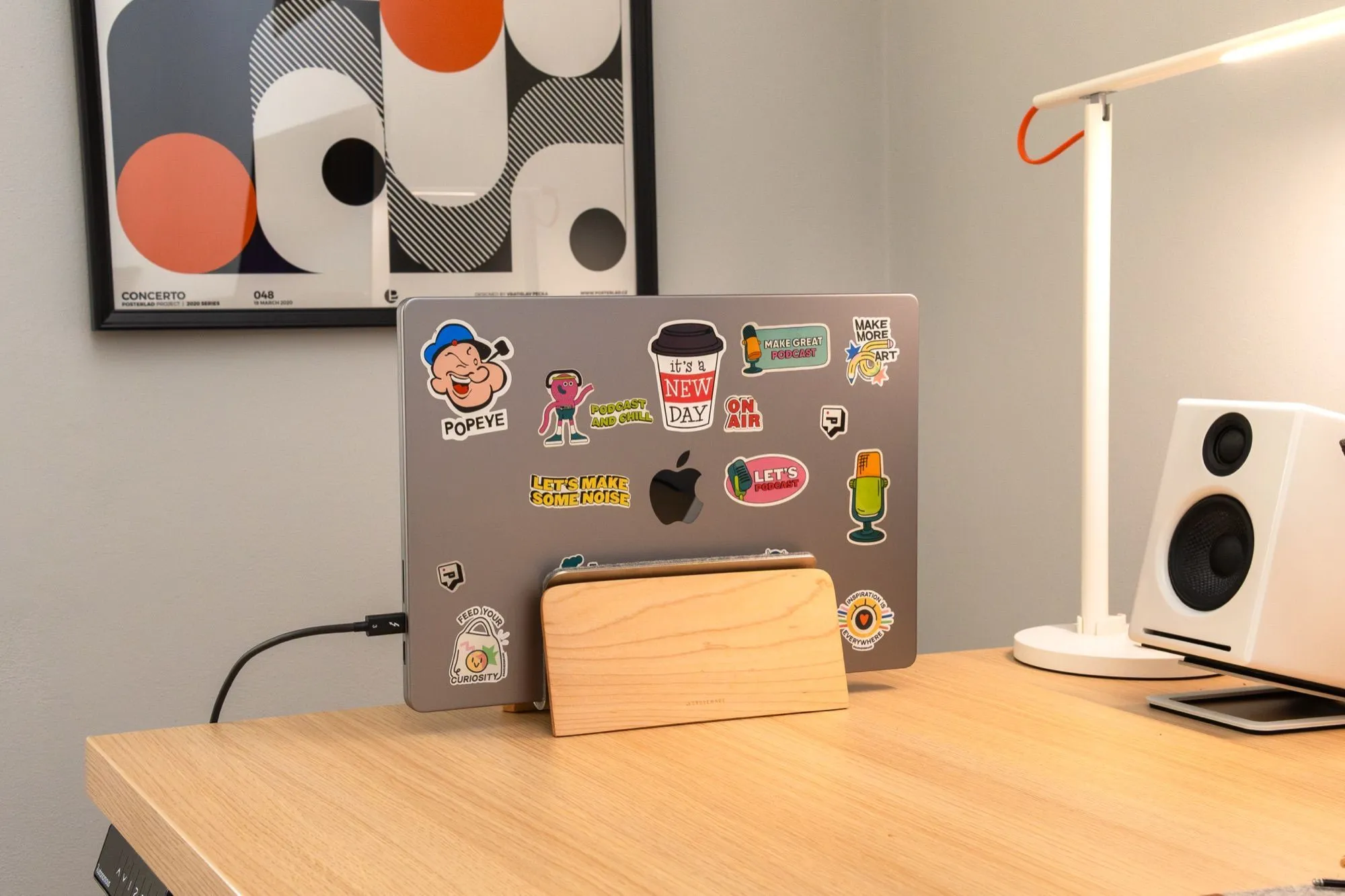 Laptop and lamp on the side of the desk