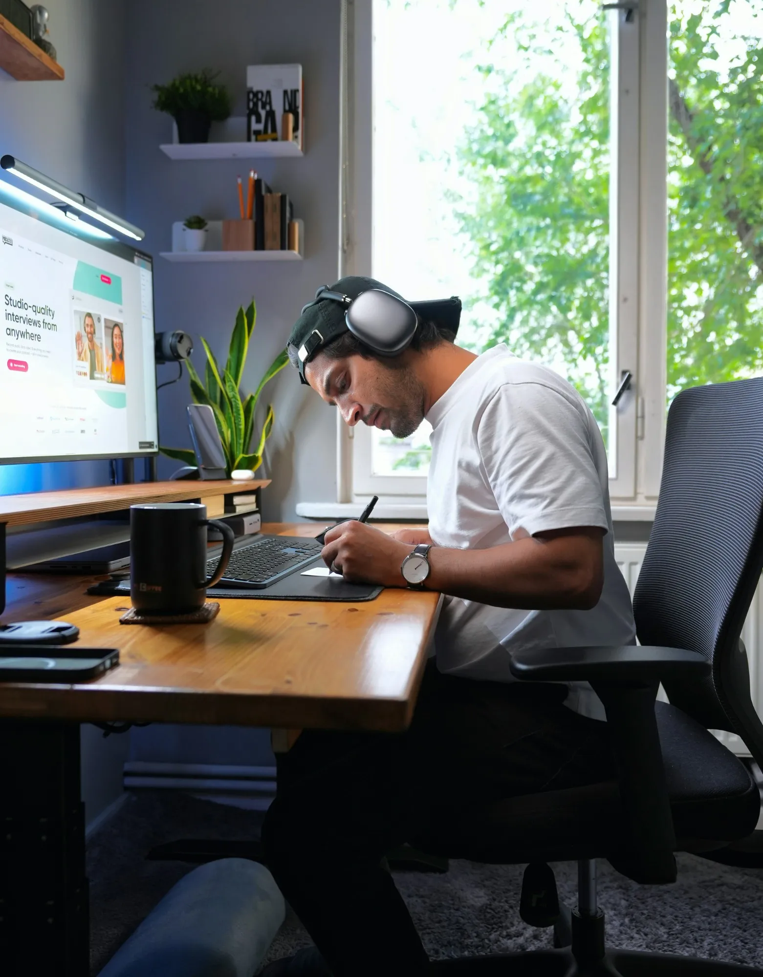 Faizur working at his desk